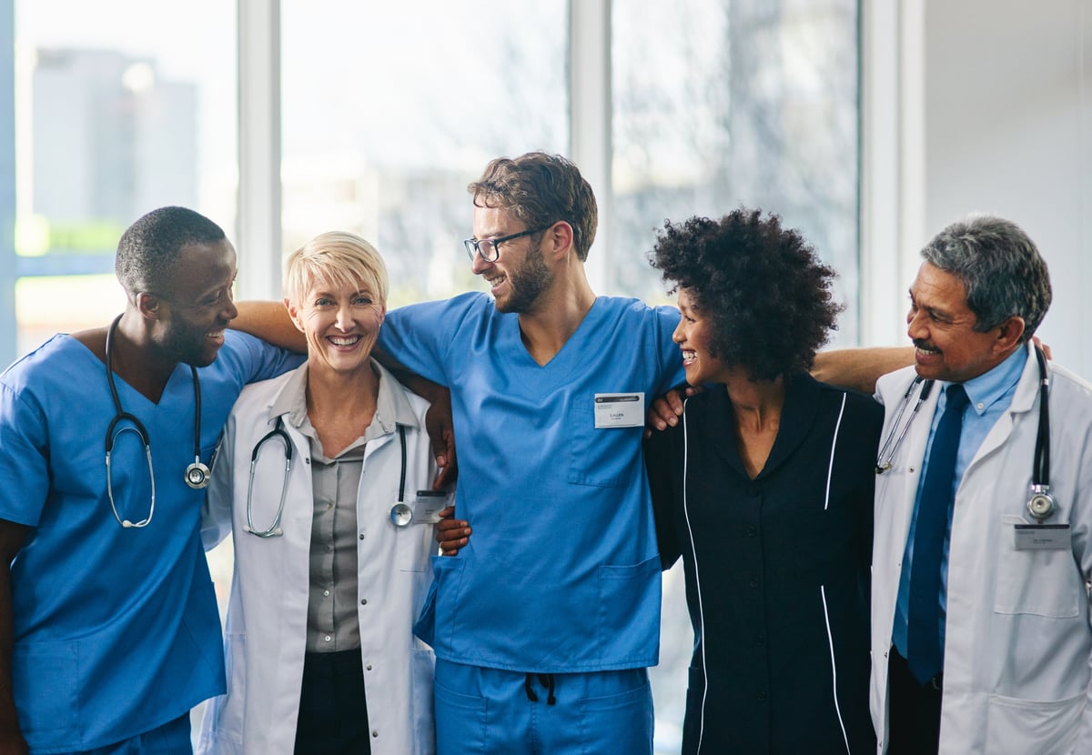 Portrait of a diverse team of doctors standing together in a hospital